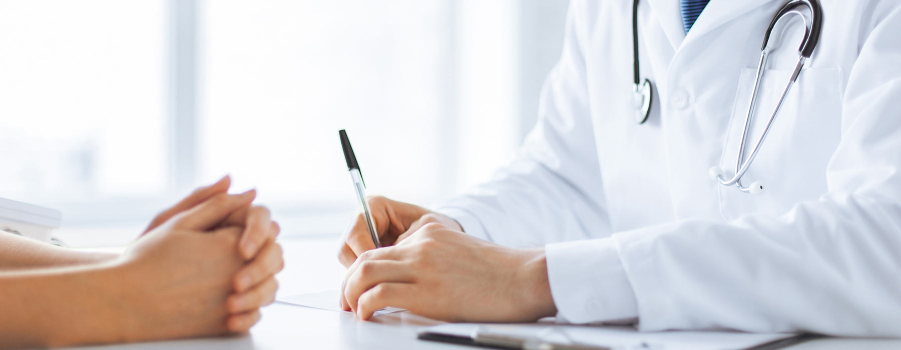 doctor discussing paperwork with patient